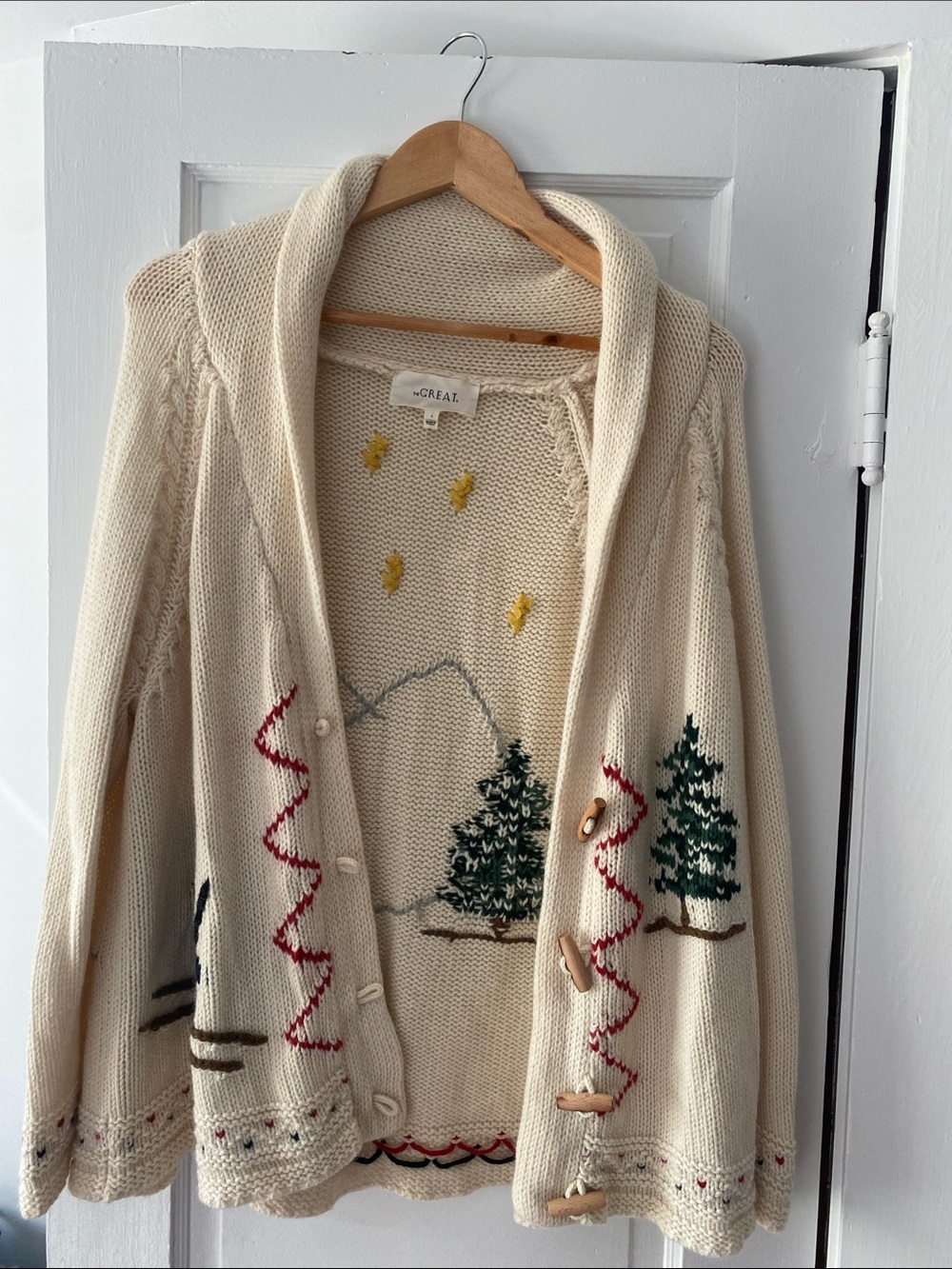 THE GREAT. Cream Hooded Embroidered Cabin Cardigan with Green Tree Motif